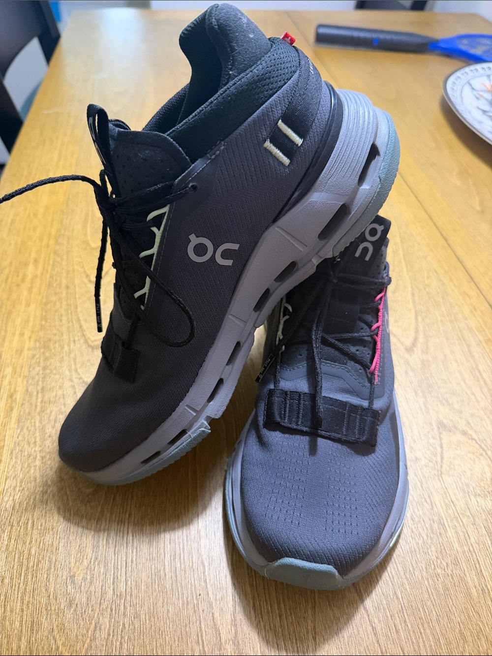On Running Men's Athletic Shoes in Black with Gray Soles and Pink Accents